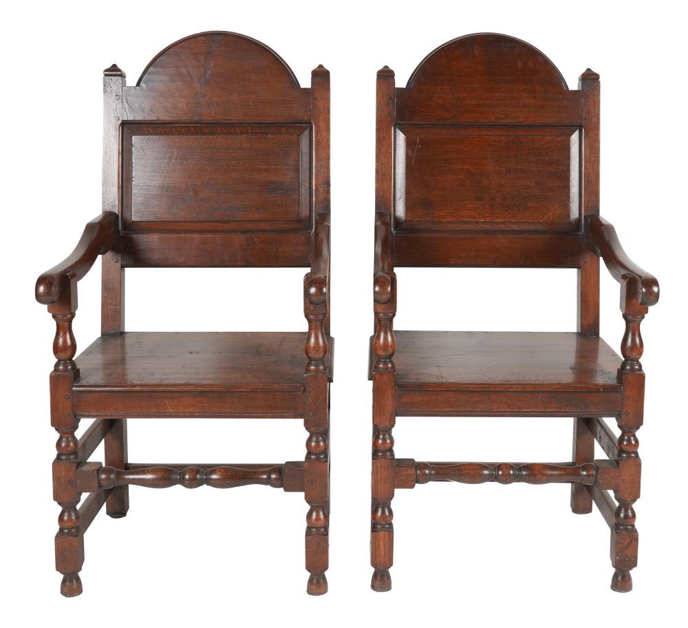 Appraisal: PAIR OF JACOBEAN REVIVAL CARVED OAK ARMCHAIRSProvenance A Cherokee Lane