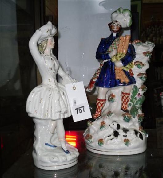 Appraisal: A Staffordshire figure of a Scotsman and a figural dancer