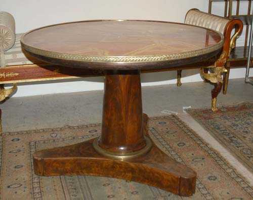 Appraisal: ROUND SALON TABLE Empire Paris circa Mahogany and burlwood veneer