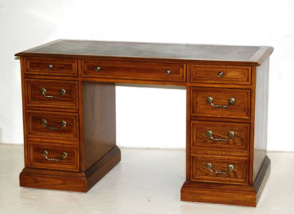 Appraisal: A George III style walnut kneehole desk