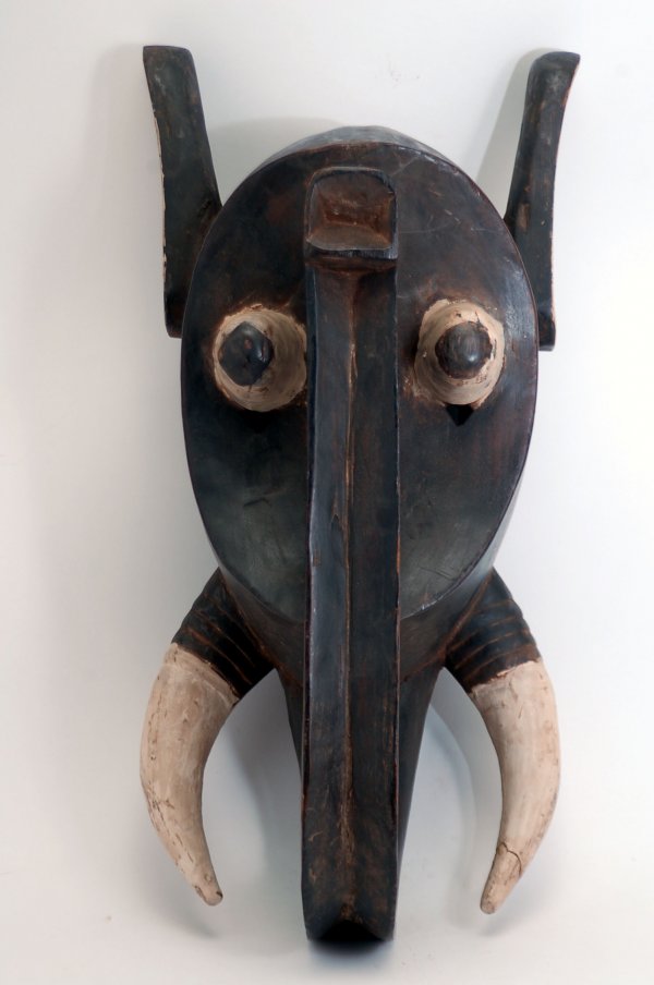 Appraisal: Baule elephant mask of wood with smooth black finish the