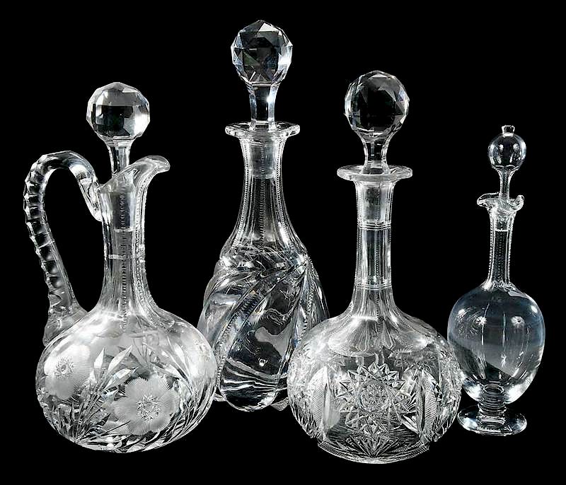 Appraisal: Four Cut Glass Decanters Baccarat Jewell footed decanter with Baccarat