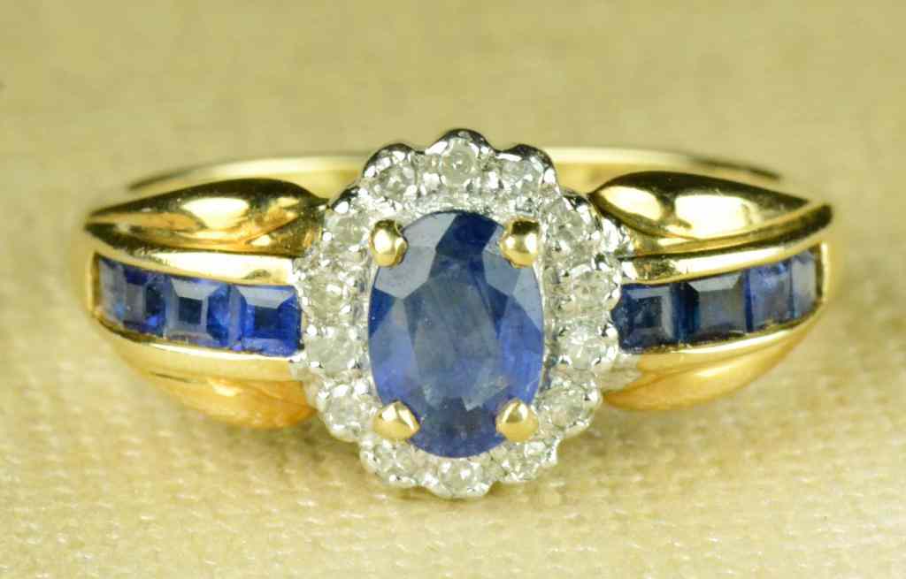 Appraisal: Sapphire and K Gold RingOval cut sapphire surrounded by small