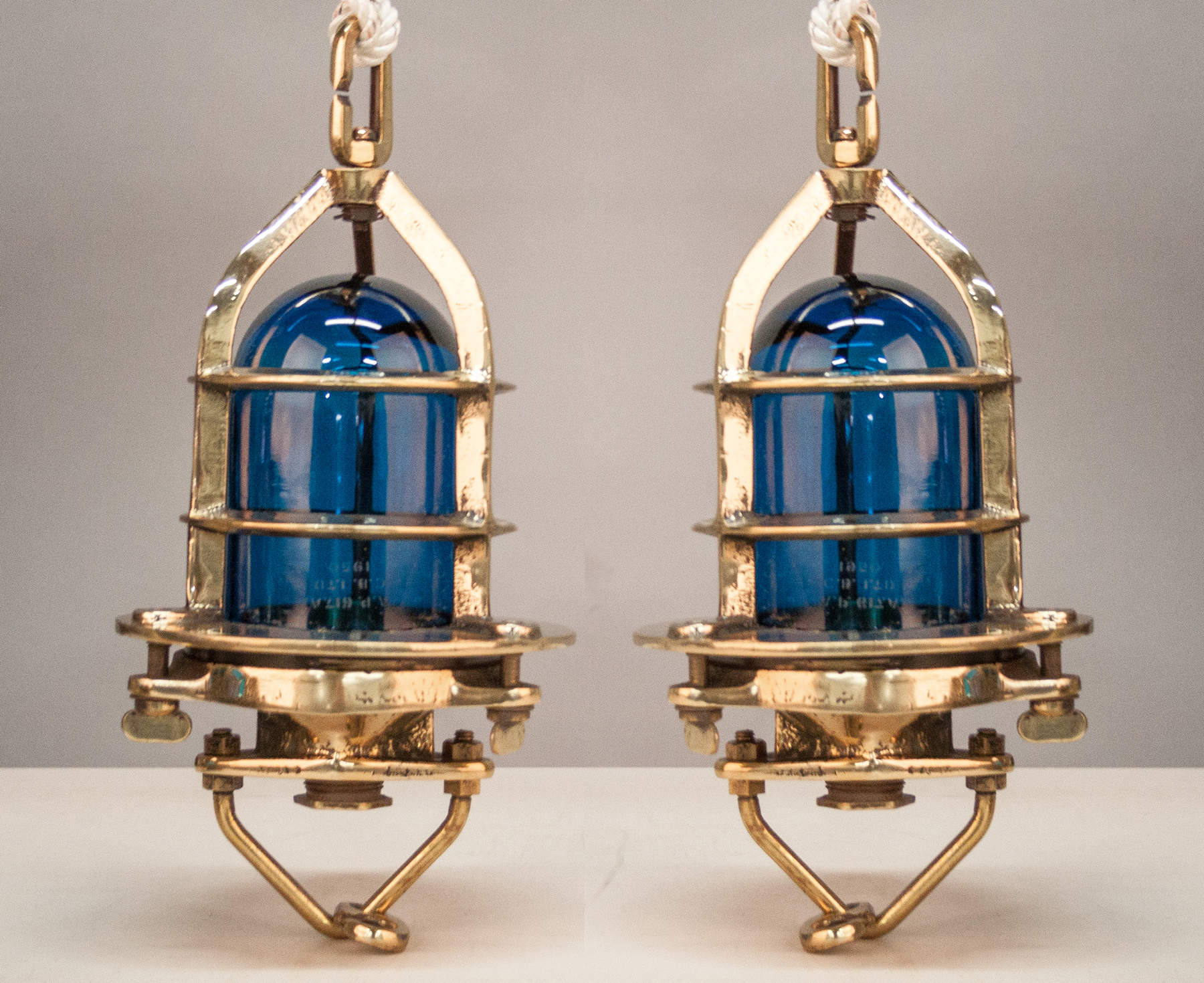 Appraisal: Two Vintage British Convy Brass Ship's Lights with Blue Globes