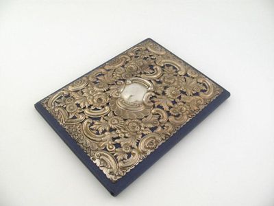 Appraisal: A late Victorian mounted leather blotter with pierced and embossed