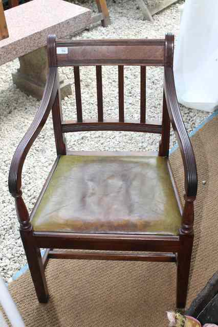 Appraisal: A GEORGE IV CARVED MAHOGANY ARMCHAIR with reeded back and