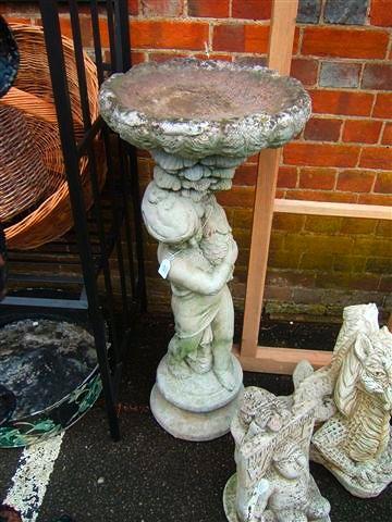 Appraisal: A reconstituted stone bird bath in the form of a