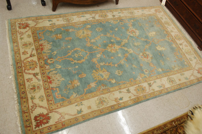 Appraisal: HAND KNOTTED ORIENTAL AREA RUG Pakistani-Persian stylized floral pattern on