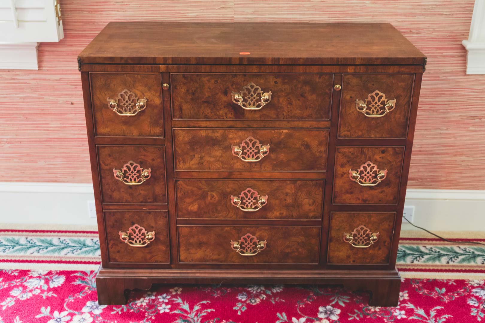 Appraisal: Baker Chippendale style burl walnut bachelor chest in H in