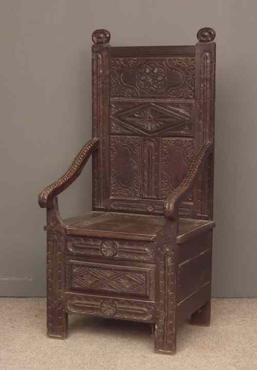 Appraisal: An old ''Black Oak'' panelled armchair of th Century design