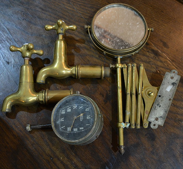 Appraisal: A Jaeger car clocktwo brass taps and a brass extending