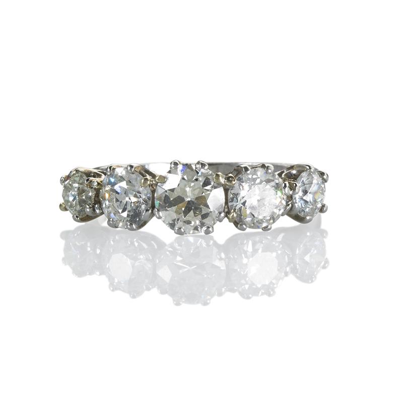 Appraisal: DIAMOND PLATINUM FIVE-STONE RING Graduated OEC diamonds in six-prong crown