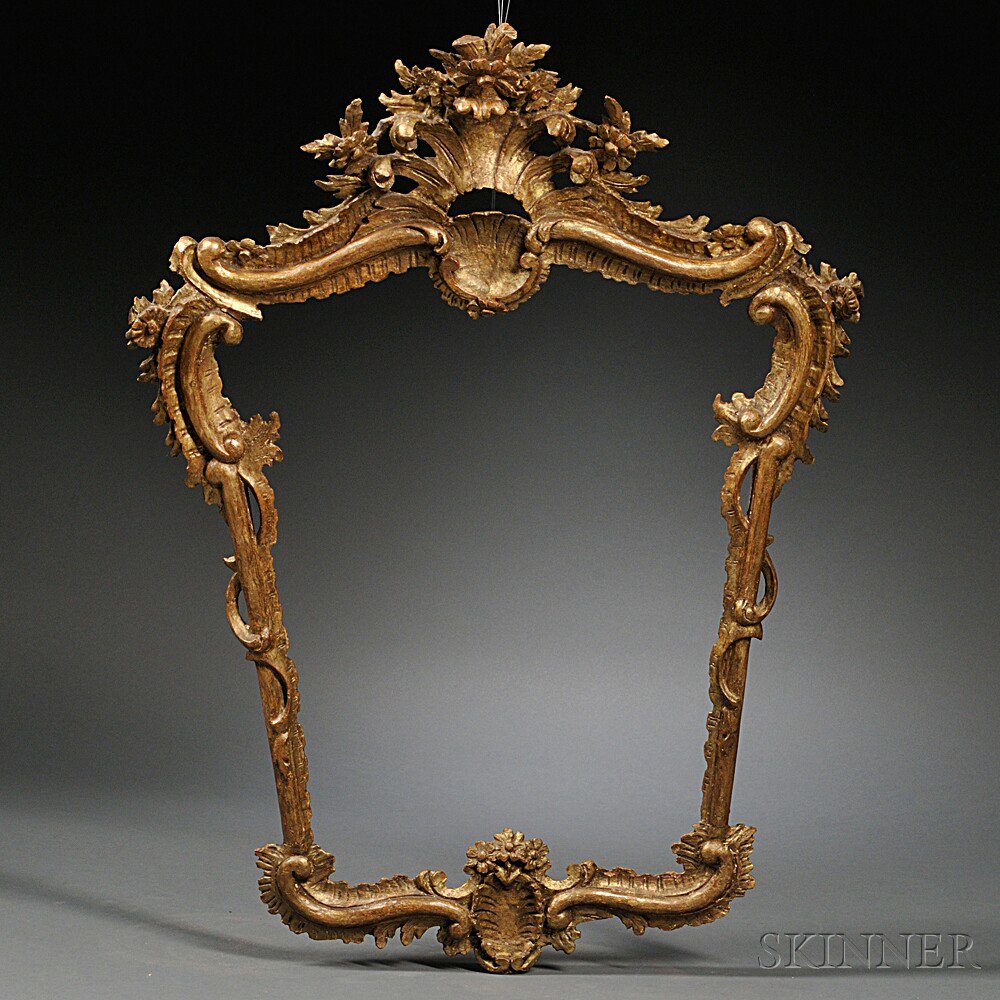 Appraisal: Italian Carved Giltwood Frame th century cartouche-shaped with a rocaille