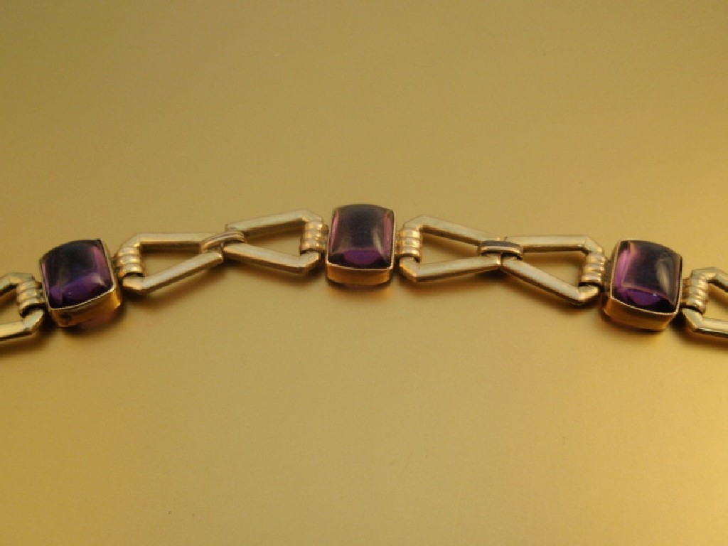 Appraisal: An openwork yellow metal bracelet set with purple pastes