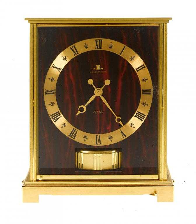 Appraisal: A JAEGER LECOULTRE BRASS ATMOS CLOCK with red marbled dial