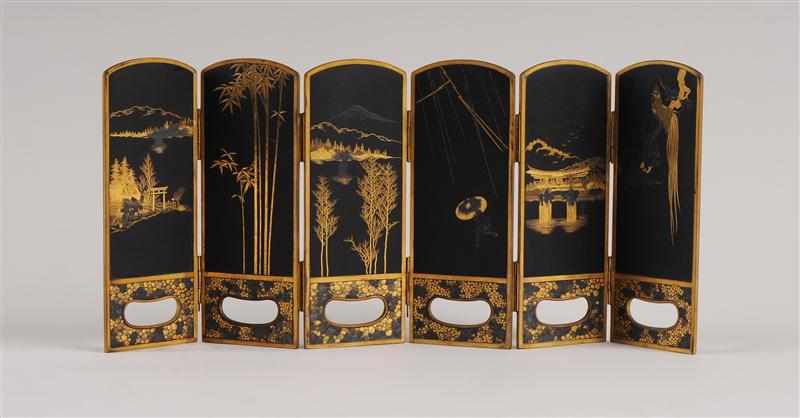 Appraisal: JAPANESE ENGRAVED GILT-BRONZE SIX-PANEL FOLDING TABLE SCREEN The arched black-ground