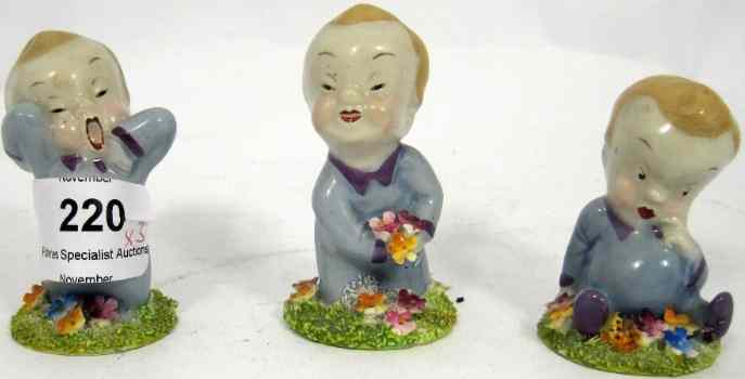 Appraisal: Wade s figures Wynken Blynken and Nod with Floral Bases