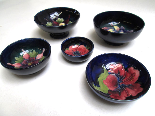 Appraisal: FIVE MOORCROFT POTTERY BOWLS each hand painted under glaze footed