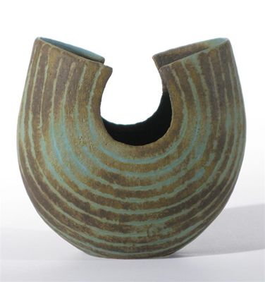 Appraisal: An earthenware vase by John Ward horse-shoe shape with incised