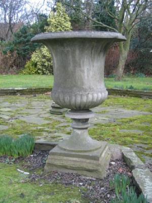 Appraisal: A PAIR OF CONTINENTAL CARVED WHITE MARBLE URNS of half