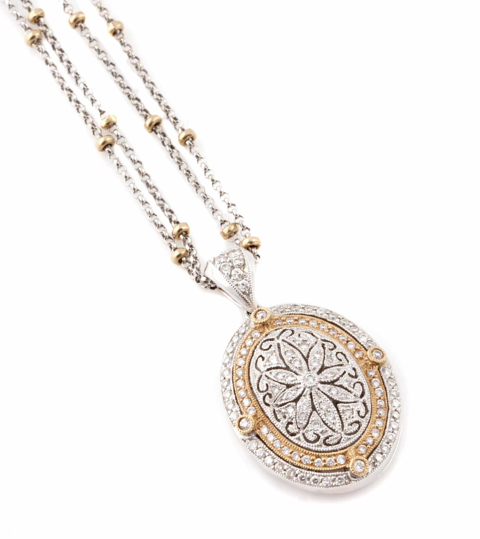 Appraisal: A diamond and k bicolor gold locket and double chain