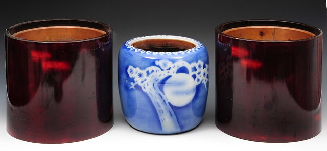 Appraisal: A pair of Japanese lacquer hibachiand a porcelain blue and