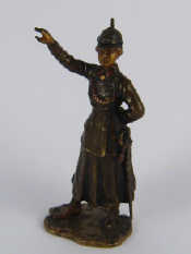 Appraisal: A cold painted Austrian bronze figure of a woman officer