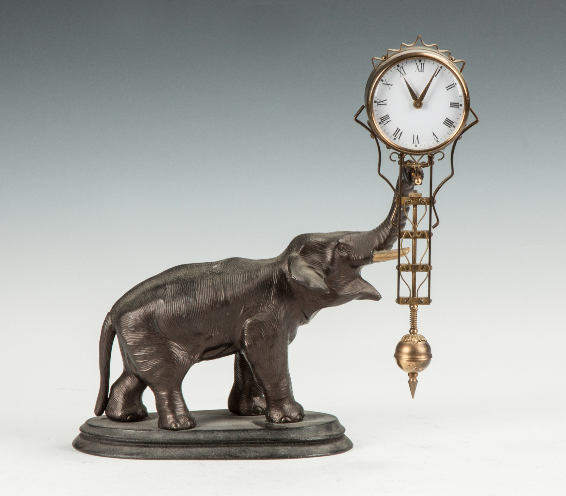 Appraisal: Junghans Elephant Swinger Clock Early th cent Patinaed metal