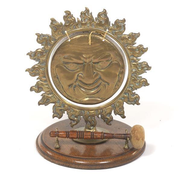 Appraisal: PATINATED BRASS AND WOOD SUN FACE GONG AND MALLET x