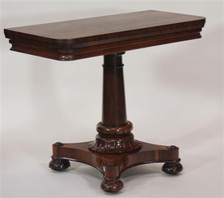 Appraisal: A th century rosewood tea table the rounded rectangular top