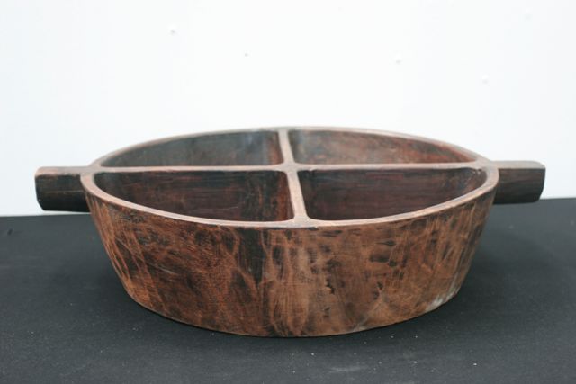 Appraisal: A traditional wooden serving bowl carved from a single piece