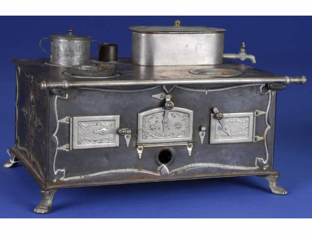 Appraisal: German Miniature Stove Germany ca embossed tin with three nickel-plated