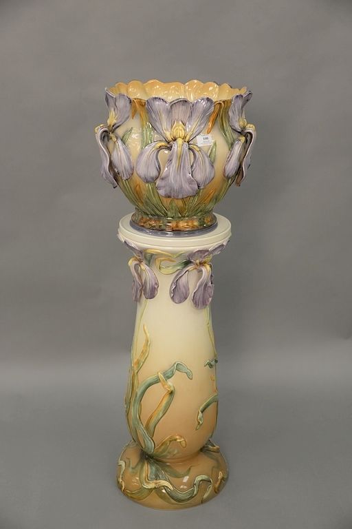 Appraisal: Large majolica jardiniere on stand stand with molded iris orchids