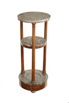 Appraisal: A French mahogany three tier stand the mottled grey marble