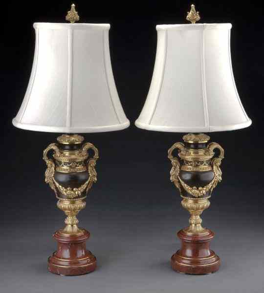 Appraisal: Pr French gilt and patinated bronze urns mountedas lamps the