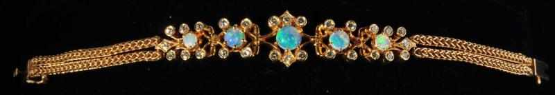 Appraisal: K Y Gold Rope Link-Style Bracelet Description With five opals