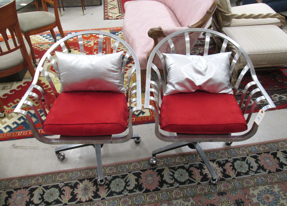 Appraisal: PAIR OF MID-CENTURY MODERN SWIVEL ARMCHAIRS aluminum construction with red