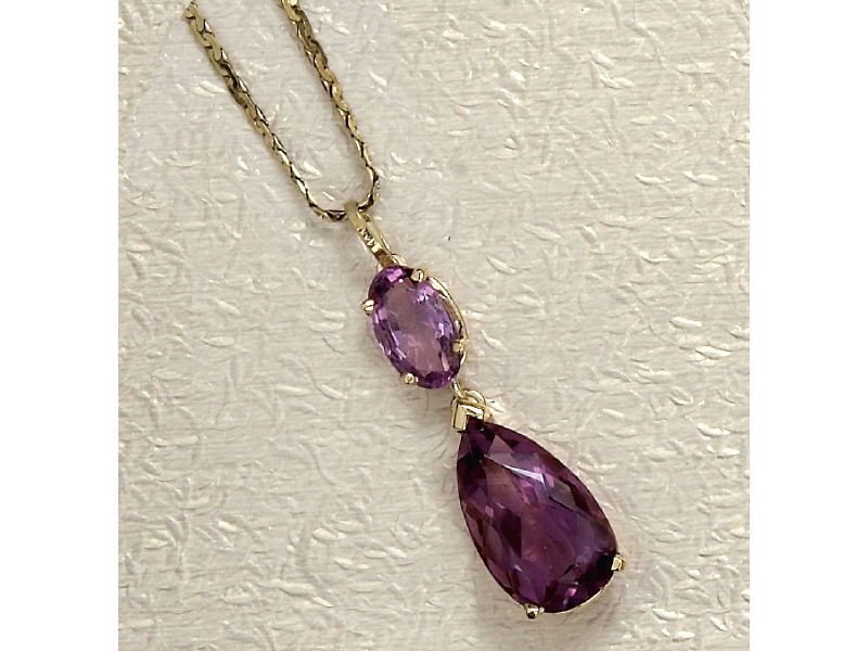 Appraisal: AMETHYST PENDANT k yellow gold dangling pendant set with one