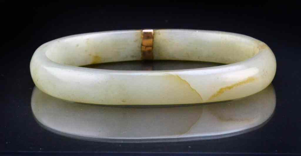 Appraisal: Chinese Qing Celedon Jade Bangle BraceletOf ovoid shape with gold