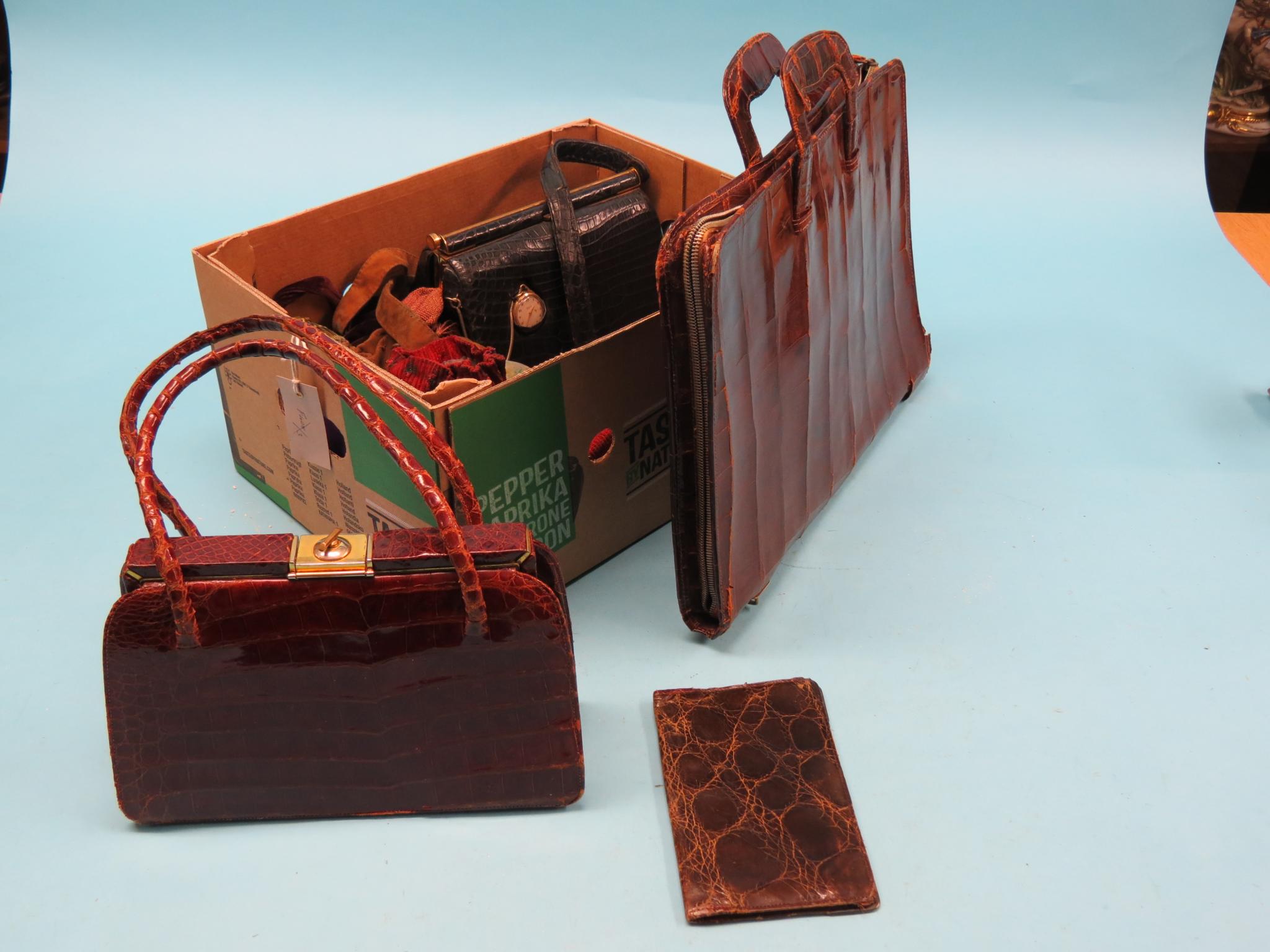 Appraisal: A gentleman's crocodile-skin briefcase similar wallet two lady's crocodile-skin handbags