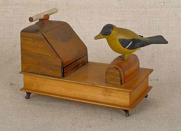 Appraisal: Carved and painted wooden mechanical cigarette dispenser ca with Goldfinch