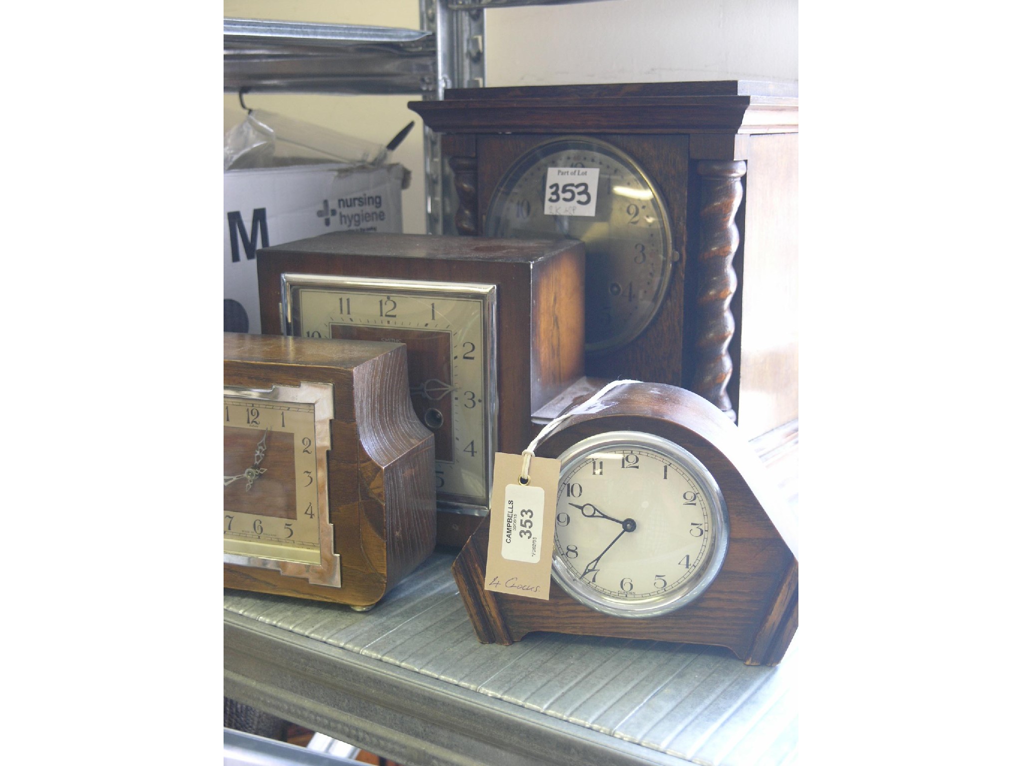 Appraisal: An oak mantel clock with spiral-twist columns in and three