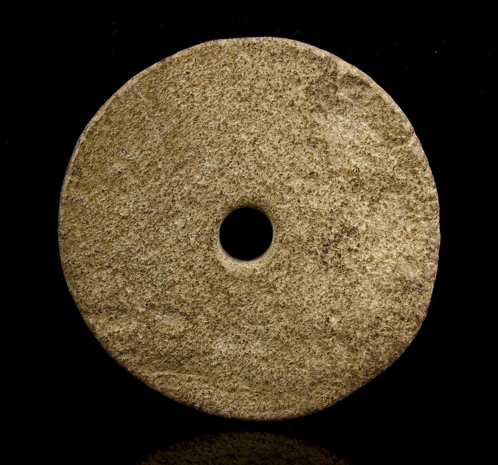 Appraisal: Liangzhu Jade A Spindle Whorl Creamy-white nephrite with brown alteration