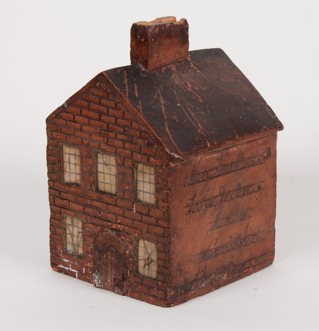 Appraisal: Staffordshire terracotta cottage dated house with incised brick decoration with