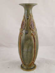 Appraisal: An Art Nouveau Doulton vase in greenish glaze with stylised