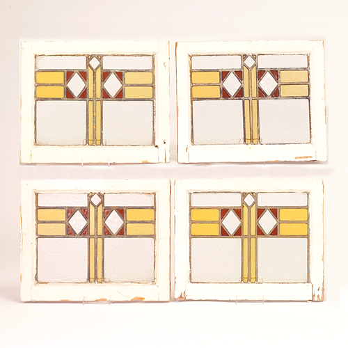 Appraisal: Four stained glass windows with yellow amber and clear glass