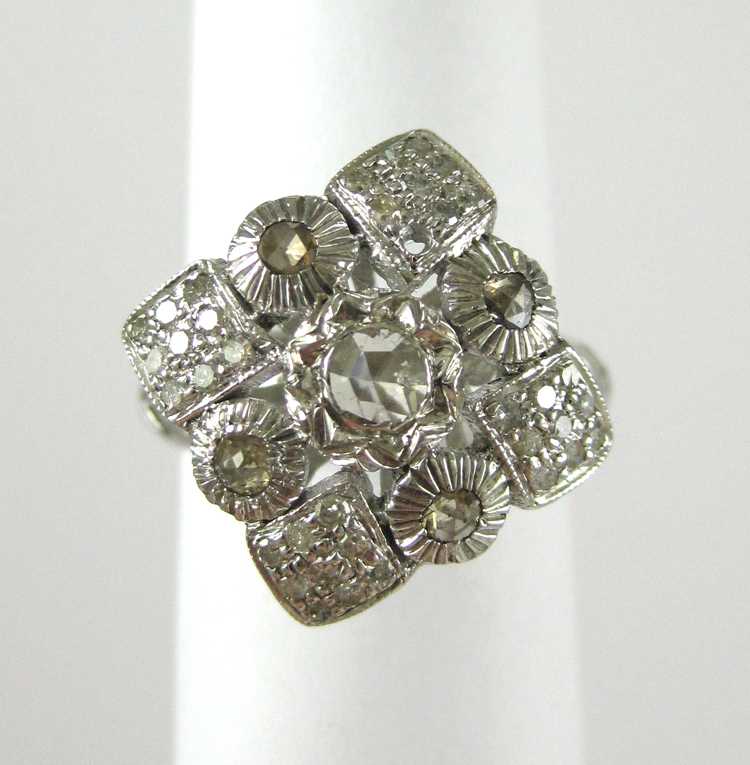 Appraisal: INDIA DIAMOND AND STERLING SILVER RING set with round single-cut