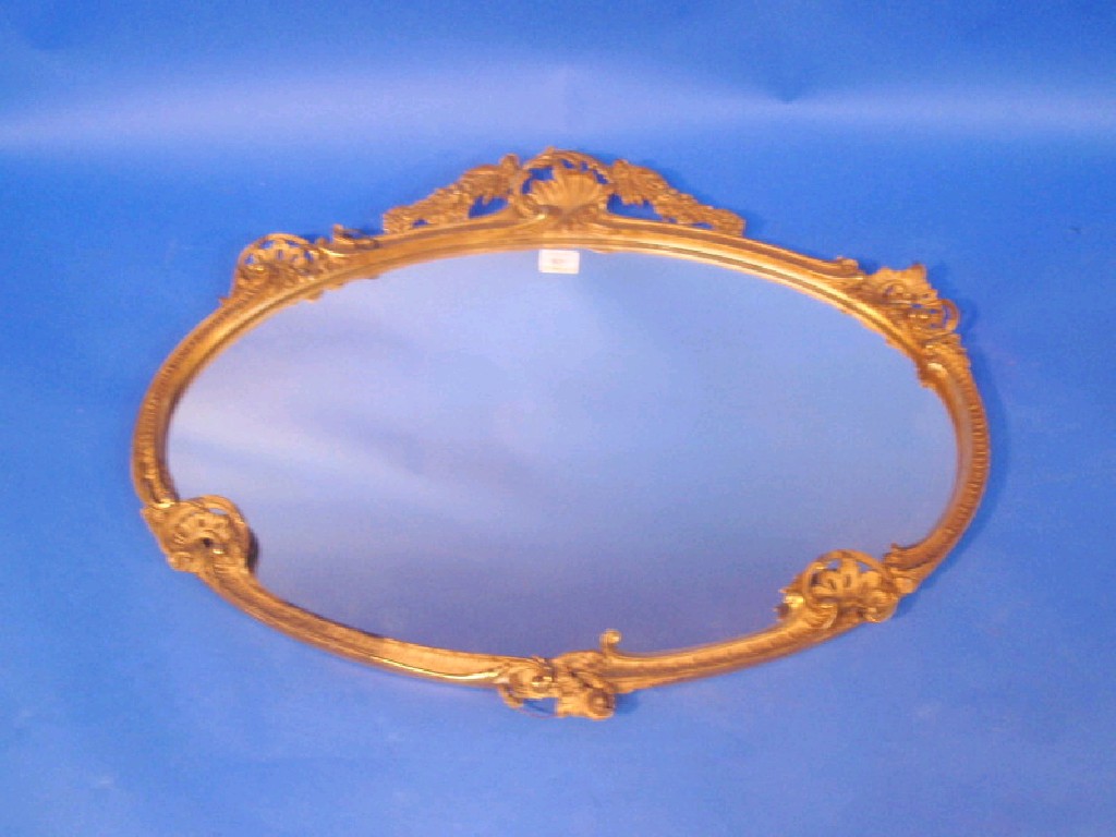 Appraisal: An oval gilt plaster wall mirror of rococo design cm