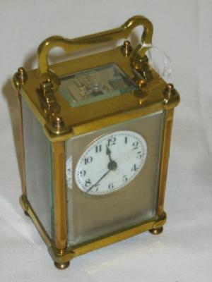 Appraisal: A CARRIAGE CLOCK with platform escapement the brass fascia with