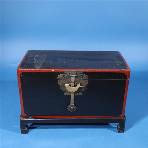 Appraisal: Chinese black lacquer chest with stand and fish-shaped lock interior